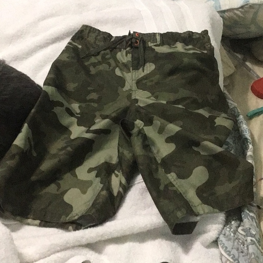 OP Boys stealth olive Camo swim trunks with 9” inseam and mesh liner.